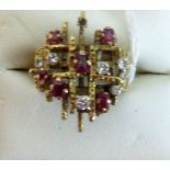 A ruby and diamond abstract design dress ring,