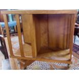 An oak and birdseye maple veneered revolving bookcase of small proportions.