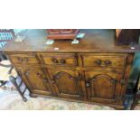 A reproduction oak low dresser,