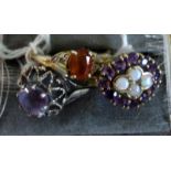 An open work amethyst and opal cluster ring,