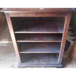 An early 20th century oak four tier open bookcase on bracket feet.