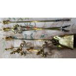 A 19th century three piece polished and lacquered brass fire side companion set and a pair of