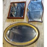 A mahogany wall mirror, the plain frame enclosing a bevelled plate,