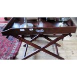 A George II mahogany butler's tray on a folding stand.