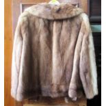 A lady's vintage, possibly beaver lamb, quarter-length fur jacket.