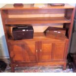 A craftsman made oak open bookcase cabinet of two shelves,