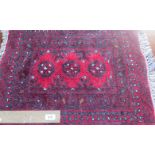 A small 20th century Bokhara-type prayer mat, 70 x 50cm.