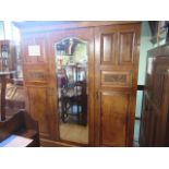 A Victorian Pollard oak triple wardrobe/press,