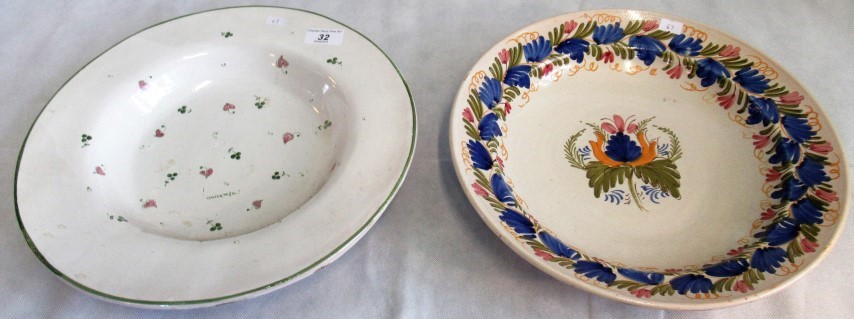 Two items of Continental faience ware, decorated in low temperature colours.