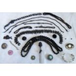 A mixed lot of carved jet and other costume jewellery,