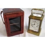 A late 19th century French ogee cased chiming brass carriage clock, with tooled Morocco travel box.