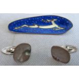 A Scandinavian enamel brooch, decorated with a running deer,