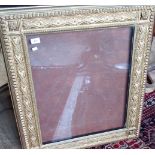 A gilt composite picture frame, having trellis moulded floral decoration and beaded slip.
