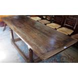 An 18th century-style oak refectory dining table,