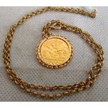 A 1910 gold sovereign with pendant mount to a trace link chain. Condition Report: 11.