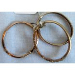 A 9ct gold rose gold bangle, the applied filigree work, another marked 9ct and a gilt metal bangle.