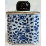 An 18th century Chinese blue and white rectangular canted form tea caddy with later carved and