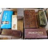 A collection of cased and boxed dominoes, draughts and chess sets,