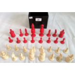 A 19th century cochineal red and natural ivory Staunton-type chess set (one pawn of similar but not