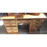 An Edwardian Pollard oak twin pedestal desk,