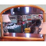 A 19th century-style gilt composite framed over mantle mirror, with plain arched plate.