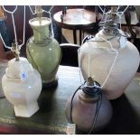 Four various ceramic table lamps (lacking shades).