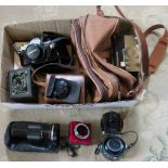 A collection of camera equipment, to include: Olympus single lens reflex camera,