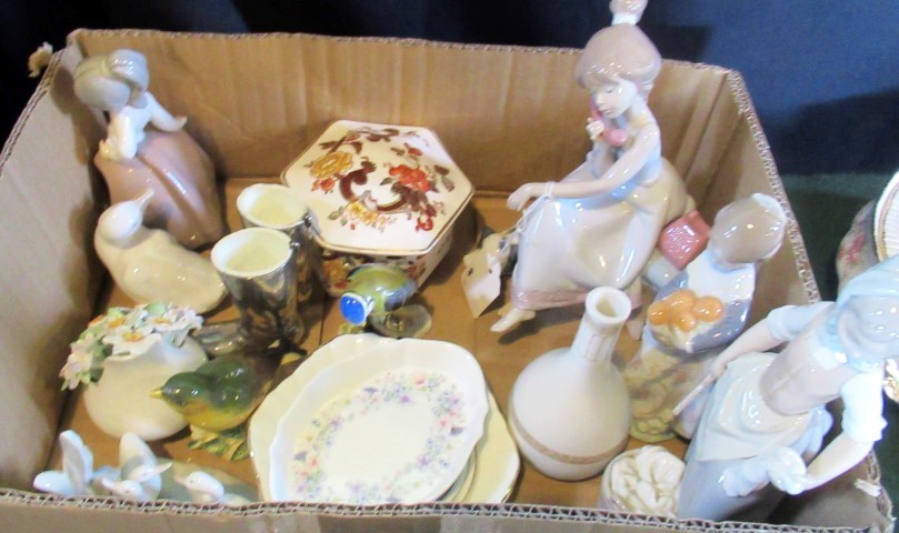 A collection of decorative porcelain, to include: Lladro and Nao porcelain figures, lidded box,