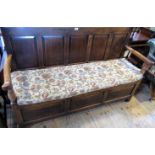 A 19th century oak settle, having a five panelled back,