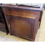 An Edwardian mahogany music cabinet,