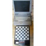 A vintage technology Toshiba Tecra vintage laptop computer, together with a Sensor chess computer.