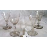 A collection of four 19th century stemmed ales and wine glasses.
