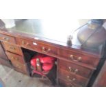 A reproduction mahogany twin pedestal writing desk,