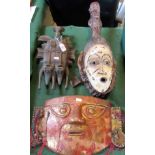 A collection of carved wood ethnic masks, to include: a Songye-style double faced mask,