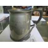 A Tudric for Libery & Co., pewter tankard with inscription.