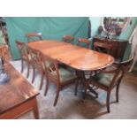A reproduction mahogany dining suite, comprising: twin pedestal crossbanded dining table,