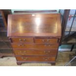 An early 20th century mahogany full front bureau,