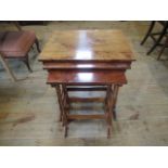 A nest of three mahogany tables.