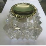 A silver topped and cut glass inkwell, London 1902, 8cm high.