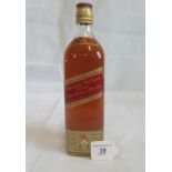A bottle of Johnny Walker Red Label Old Scotch Whisky.