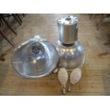 A pair of industrial aluminium lamps.