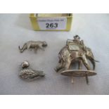 A small cast model of an elephant, a cast silver model of a tiger and a duck brooch.