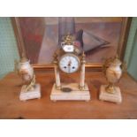 A 19th century three piece marble and brass mounted clock garniture.