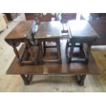 A reproduction oak coffee table, together with an oak stool and two small drop-leaf tables.