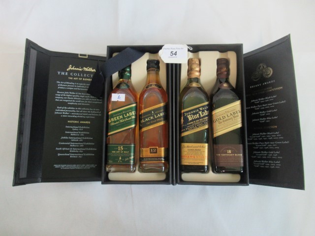 A presentation pack of four half bottles of Scotch Whisky, to include: Johnny Walker Green Label,