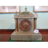 An onyx and gilt mounted mantle clock in the neo classical style.