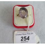 A single stone amethyst dress ring,