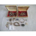 A quantity of silver and white metal costume jewellery.