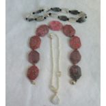 Three various bead necklaces.