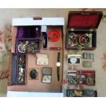 A large box containing white metal brooches, watches, cufflinks and other miscellaneous items.